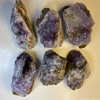 Six amethyst quartz clusters laid out