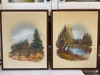 Both framed paintings side-by-side showing full fronts
