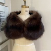Front view of brown fox fur wrap on mannequin