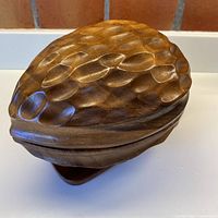 overall view of carved nut-shaped bowl with lid