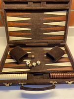 Full open view of board with checkers, dice, cups in place