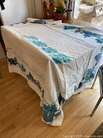 Entire tablecloth draped over table showing overall design