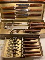 Full set in open box showing all 15 pieces