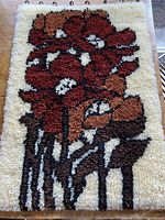 Full view of hooked wall hanging showing overall design and hanging loops