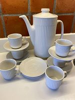 full view of pot, cups and saucers