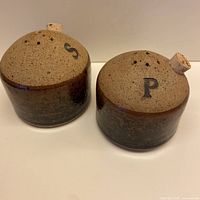 Top view of both shakers showing letters and pour holes