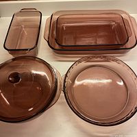 Overview of five amethyst Pyrex pieces