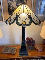 Full view of stained glass lamp showing shade, column and base