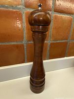 Full view of tall maple pepper grinder