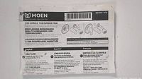 Label showing brand Moen and product details: one handle tub shower trim.