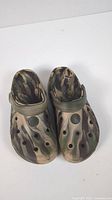 Pair of camouflage slip-on shoes with ventilation holes and adjustable strap