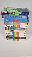 Stack of 11 VHS tapes showing titles and labels