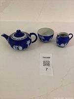 All three pieces side by side: teapot with lid, sugar bowl, and creamer.