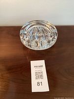 Front angle view showing textured globe-like interior pattern and clear glass transparency.