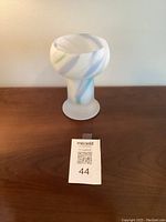 Front and top view of the vintage Kosta Boda blue Zelda satin glass vase showing frosted glass finish and swirling color pattern.