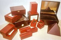 Overall assortment of dark wood boxes of various shapes and sizes, showing the range included in the lot.