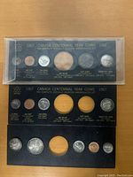 Top view of the full Canada 1967 Centennial Year coin set in original display holder, showing the 6 slots holding each coin with printed labels and dates.