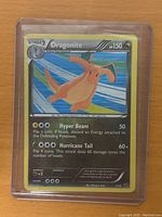 Front view of Dragonite Pokémon card showing art, attacks, and stats.