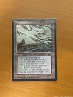 Front of 'Thawing Glaciers' Magic: The Gathering card showing art and card text.