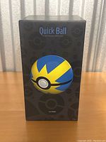 Front view of the sealed box displaying the Quick Ball electronic replica image and branding.
