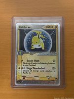Front view of the 2003 Raichu EX Pokemon card showing the holographic foil and attacks.