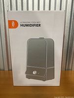 Front view of the product box showing the Ultrasonic Cool Mist Humidifier image and Trotronics branding.