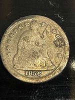Obverse view of the 1856 Half Dime showing seated Liberty figure and date.