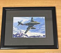 Front view of framed artwork showing Messerschmitt Me 262 jet plane over snowy mountainous terrain.
