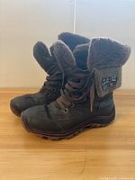 Side angle showing full boot with fur lining and sole tread