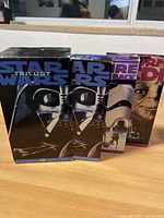 Front view of the Star Wars Trilogy VHS box set showing front cover artwork featuring Darth Vader and other characters.