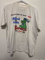 Full front view of white vintage Piero XL T-shirt with colorful cartoon crocodile and text graphic