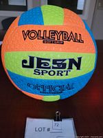 Front view of the tri-color JESN Sport soft grip beach volleyball with branding and official markings visible.