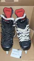 Front view of CCM RBZ ice hockey skates showing the black and white laces and red tongue label with RBZ branding.