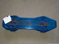 Top and bottom views of blue translucent Neon child skateboard showing branding, grip pads, trucks, and wheels