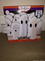 Box for PartyAire 3 Pack Reusable Inflatable Ghosts showing spider web and Halloween design on front.