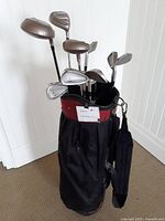 Full view of the senior golf bag loaded with various golf clubs including woods and irons.
