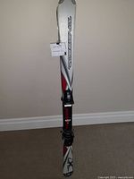 Full view of one Rossignol ski showing length, color and binding detail.