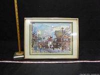 Front view of framed artwork showing full image of Bay Street scene with ruler for scale.
