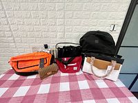 Front view of all items together on table with red and white checkered tablecloth