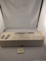 Closed box labeled 'CANUCKS CARDS' with notes of contents