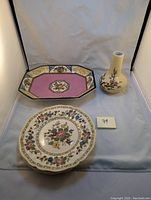 Photo showing Wedgwood Melody Orange serving plate, Royal Doulton Cavendish side plates stacked, porcelain cherry blossom vase