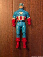 Front view of Kenner 1990 Captain America action figure in blue, red, and white costume with star on chest.