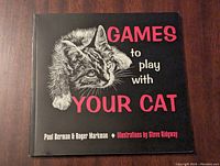 Front cover of the book showing title, cat illustration, and authors' names.