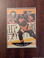 Front side of Jaromir Jagr 1990-1991 NHL Pro Set rookie card showing player in Pittsburgh Penguins uniform in action.