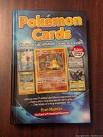 Front cover of the Pokemon Cards guide book showing colorful images of Pokemon cards and title
