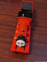 Top-down front view of the red James engine with black funnel and face sticker.