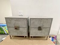 Front view showing two matching side tables side by side against wall