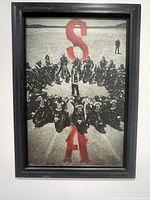Front view of Sons of Anarchy framed poster showing main artwork and red letters.