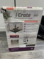 Damaged box of MidWest iCrate with visible product branding and usage info