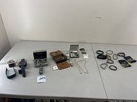 Overview of all watches, bracelets and jewelry on table